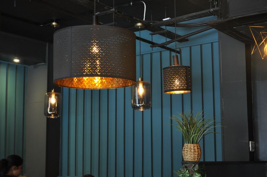 Pendant lighting over the panelled wall